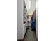 Walk-in closet with custom shelving and ample storage space at 6411 Mayra Shores Ln, Apollo Beach, FL 33572