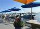 Outdoor dockside dining area under colorful sun umbrellas at 6411 Mayra Shores Ln, Apollo Beach, FL 33572