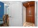 Interior elevator highlighting wood paneling and modern controls in a residential setting at 6411 Mayra Shores Ln, Apollo Beach, FL 33572