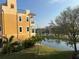 Luxury building with balconies overlooking pond and fountain at 6411 Mayra Shores Ln, Apollo Beach, FL 33572
