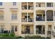 Elegant condo building with multiple balconies, offering residents private outdoor living spaces at 6411 Mayra Shores Ln, Apollo Beach, FL 33572
