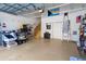 Functional garage features stairs to the living area and built-in storage solutions for easy organization at 6411 Mayra Shores Ln, Apollo Beach, FL 33572