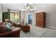 Comfortable living room features a decorative ceiling fan and access to a small patio at 6411 Mayra Shores Ln, Apollo Beach, FL 33572