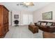Large living room with a decorative cabinet and comfortable seating arrangement at 6411 Mayra Shores Ln, Apollo Beach, FL 33572
