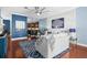 Cozy living room featuring a plush sofa, nautical decor, and an inviting open layout with adjacent kitchen at 6411 Mayra Shores Ln, Apollo Beach, FL 33572