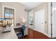 The office features a desk overlooking a street scene and a view of the bedroom at 6411 Mayra Shores Ln, Apollo Beach, FL 33572