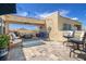 Relaxing outdoor patio featuring comfortable seating, a cozy fire pit, and a charming bar area at 6411 Mayra Shores Ln, Apollo Beach, FL 33572