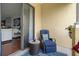 Cozy patio featuring a comfortable cushioned chair and an ornate side table at 6411 Mayra Shores Ln, Apollo Beach, FL 33572