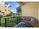 Scenic patio with a bench overlooking a pond with a fountain and manicured landscaping at 6411 Mayra Shores Ln, Apollo Beach, FL 33572