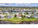 Aerial view of a home in a waterfront community with private pool and mature landscaping at 811 Eagle Ln, Apollo Beach, FL 33572