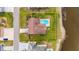 Aerial view of a cozy backyard featuring a private pool and lush greenery at 811 Eagle Ln, Apollo Beach, FL 33572