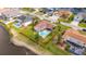 Aerial view of fenced backyard with in ground pool and lush lawn at 811 Eagle Ln, Apollo Beach, FL 33572