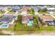 Aerial view of a beautiful backyard with a private pool and well-maintained lawn at 811 Eagle Ln, Apollo Beach, FL 33572