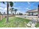 Backyard with a well maintained lawn and a stunning in ground pool at 811 Eagle Ln, Apollo Beach, FL 33572