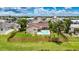 Backyard with a private pool, and a wooden fence providing privacy and security at 811 Eagle Ln, Apollo Beach, FL 33572
