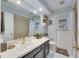 Well-lit bathroom with a single vanity, neutral color palette and a tub shower at 811 Eagle Ln, Apollo Beach, FL 33572