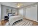 Cozy bedroom featuring wood floors, ceiling fan and closet space at 811 Eagle Ln, Apollo Beach, FL 33572