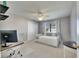 Charming bedroom with a daybed, ceiling fan, desk and ample natural light at 811 Eagle Ln, Apollo Beach, FL 33572