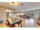 Open dining area with hardwood floors and stylish lighting, perfect for Gathering gatherings at 811 Eagle Ln, Apollo Beach, FL 33572