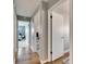Hallway with wood floors and views into bedrooms at 811 Eagle Ln, Apollo Beach, FL 33572