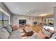 Spacious living room with hardwood floors, large windows, and comfortable seating area at 811 Eagle Ln, Apollo Beach, FL 33572
