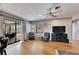 Cozy living room with hardwood floors, comfortable seating, and a sliding glass door to the patio at 811 Eagle Ln, Apollo Beach, FL 33572