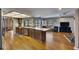 Open living space with a long bar to the kitchen with stainless steel appliances at 811 Eagle Ln, Apollo Beach, FL 33572