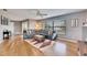 Inviting living room with hardwood floors, a large window, and a cozy sectional sofa at 811 Eagle Ln, Apollo Beach, FL 33572