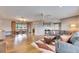 Bright, open-concept living room featuring hardwood floors and sliding glass doors at 811 Eagle Ln, Apollo Beach, FL 33572