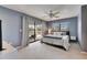 Comfortable main bedroom with neutral tones and a sliding glass door to backyard pool at 811 Eagle Ln, Apollo Beach, FL 33572