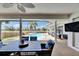 Outdoor dining area with pool view provides a serene and inviting atmosphere for entertaining at 811 Eagle Ln, Apollo Beach, FL 33572