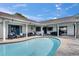 Inviting backyard pool with covered patio, perfect for relaxing and enjoying the outdoors at 811 Eagle Ln, Apollo Beach, FL 33572