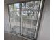 This photo showcases a balcony with a view of lush trees and a nearby building at 8158 Eagles Park N Dr, St Petersburg, FL 33709