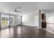 Inviting living room with luxury vinyl plank flooring, a ceiling fan and natural light at 8428 Highland Pines Ct, Plant City, FL 33565