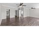 Spacious main bedroom with hard wood floors, white trim, multiple closets, and ceiling fans at 8428 Highland Pines Ct, Plant City, FL 33565