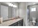 Bathroom featuring granite countertops, modern fixtures, and a shower-tub combo at 8816 Mugnai St, Riverview, FL 33578