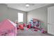 Charming bedroom provides plenty of space for toys and games at 8816 Mugnai St, Riverview, FL 33578
