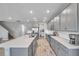 Spacious kitchen with stainless steel appliances, gray cabinetry, and a large island at 8816 Mugnai St, Riverview, FL 33578