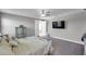 Comfortable main bedroom features neutral walls, ceiling fan, and private entry to the main bathroom at 8816 Mugnai St, Riverview, FL 33578