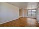 Bright living room with tiled flooring, natural light, and backyard access at 96 New York Avenue, Dunedin, FL 34698