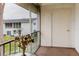 Enclosed porch showcasing outdoor storage area with neutral colored carpet at 105 47Th Avenue W Dr # 374, Bradenton, FL 34207