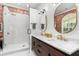Modern bathroom featuring dual vanity, glass shower, and stylish fixtures and hardware at 1051 Point Seaside, Crystal Beach, FL 34681