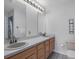 Bathroom boasts double sinks, hard floors, and neutral walls at 11103 Hannaway Dr, Riverview, FL 33578