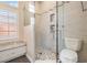 Modern bathroom with sleek glass shower, tiled walls, and a granite topped vanity at 1200 Country Trails Dr, Safety Harbor, FL 34695