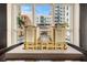 Architectural model showcasing a multi-story building with a pool and outdoor amenities, seen through a window at 1238 E Kennedy Blvd # 704, Tampa, FL 33602