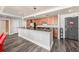 Spacious kitchen with granite countertops, stainless steel appliances, and dark wood cabinetry at 1238 E Kennedy Blvd # 704, Tampa, FL 33602