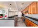 Spacious kitchen with granite countertops, stainless steel appliances, and dark wood cabinetry at 1238 E Kennedy Blvd # 704, Tampa, FL 33602