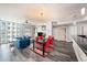 Bright living room featuring a large window, modern furnishings and gray hardwood floors at 1238 E Kennedy Blvd # 704, Tampa, FL 33602