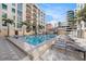 Resort style community pool with lounge chairs, cabana and beautiful tropical landscaping at 1238 E Kennedy Blvd # 704, Tampa, FL 33602