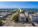 Aerial view of condo building with waterfront access, parking, and an ideal location near the beach and intercostal waterway at 131 Bluff View Dr # 208, Belleair Bluffs, FL 33770